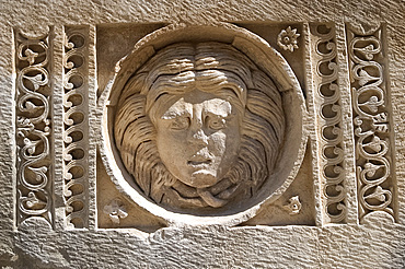 A stone carving of a head in the ruins at Myra on the south coast, Anatolia, Turkey, Asia Minor, Asia