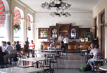 The veranda cafe and bar at the Casa Granda Hotel, Parque Cespedes, Santiago de Cuba, Cuba, West Indies, Central America