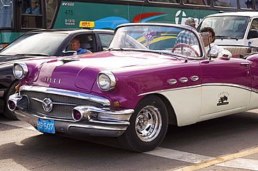 A vintage 1950's American car used for taking tourists sightseeing, Havana, Cuba, West Indies, Central America