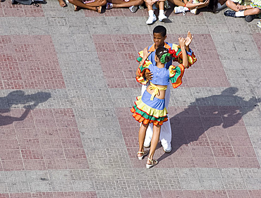 School kids dancing in Parque Cespedes during a school festival, Santiago de Cuba, Cuba, West Indies, Central America