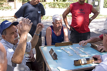 Men playing dominoes in the Vedado district, Havana, Cuba, West Indies, Central America