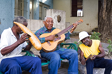 Musicians playing on the street in Santiago de Cuba, Cuba, West Indies, Central America