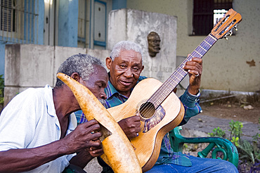 Musicians playing on the street in Santiago de Cuba, Cuba, West Indies, Central America