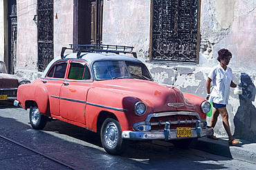 A vintage 1950's American Chevrolet parked on a street in Santiago de Cuba, Cuba, West Indies, Central America