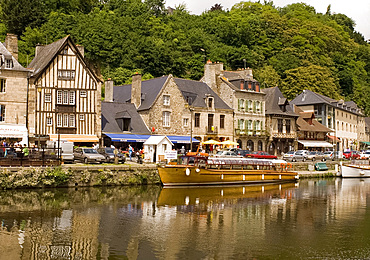 Boats on the River Rance, medieval buildings, and waterfront cafes in Port du Dinan, Brittany, France, Europe