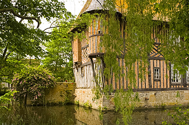 The half timbered manoire (manor house) and surrounding moat in Coupesarte, Normandy, France, Europe