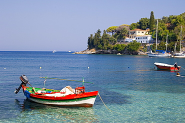 A colourful fishing boat in the harbour in Loggos, Paxos, Ionian Islands, Greek Islands, Greece, Europe