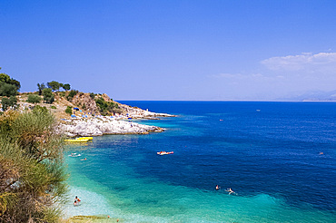 Swimmers in the sea near Kassiopi, northeast coast, Corfu, Ionian Islands, Greek Islands, Greece, Europe