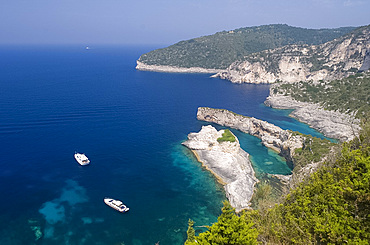 Aerial view of dramatic limestone formations at Bougazi and Avlaki, west coast, Paxos, Ionian Islands, Greek Islands, Greece, Europe