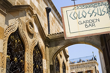 A distinctive old Lindian style building and sign for a bar in Lindos, Rhodes, Dodecanese Islands, Greek Islands, Greece, Europe