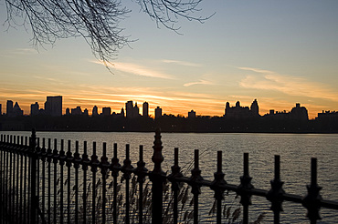 A view over the Central Park Reservoir to the Manhattan skyline at sunset, New York City, United States of America, North America