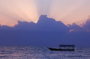 An old wooden boat in the Indian Ocean at sunrise, Paje, Zanzibar, Tanzania, East Africa, Africa