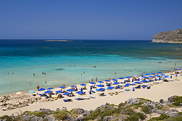 Umbrellas on the beach and emerald seas at Phalassarna (Falassarna) in Western Crete, Greek Islands, Greece, Europe