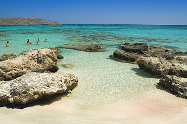 Swimmers in the sea at Elafonisi in western Crete, Greek Islands, Greece, Europe