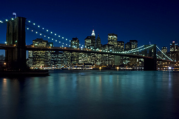 The Brooklyn Bridge and the Manhattan skyline at dusk, New York City, New York State, United States of America