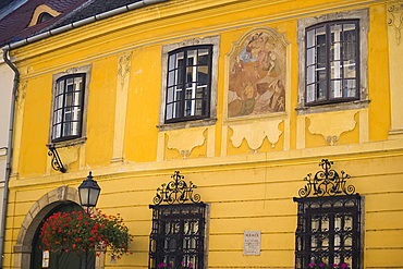 A colourful old building with a painting on the front in the Buda section, Budapest, Hungary, Europe