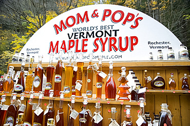 Bottles of maple syrup for sale at a roadside stand at Moss Glen Falls in Granville, Vermont, New England, United States of America, North America