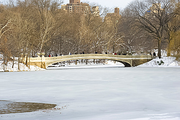 The Bow Bridge and Central Park Lake after a snowstorm, New York City, New York State, United States of America, North America