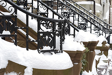 Snow on the iron railings of brownstone houses on the upper west side of Manhattan, New York City, New York State, USA