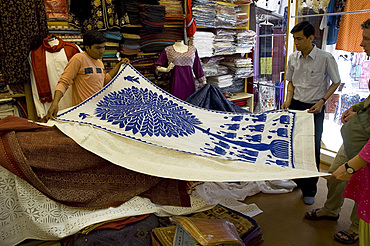 A blue and white appliqued wall hanging on display in a shop in Udaipur, Rajasthan, India, Asia