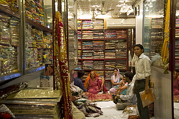 People in a sari shop in Old Delhi, India, Asia