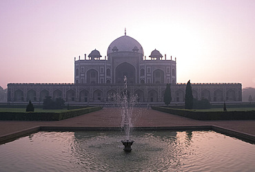 A fountain and reflecting pool in front of Humayan's Tomb at sunrise, UNESCO World Heritage Site, New Delhi, India, Asia