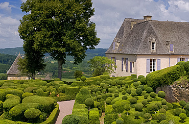 Elaborate topiary surrounding the chateau at Les Jardins de Marqueyssac in Vezac, Dordogne, France, Europe