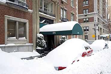 Cars buried in snow on Park Avenue after a blizzard in New York City, New York State, United States of America, North America