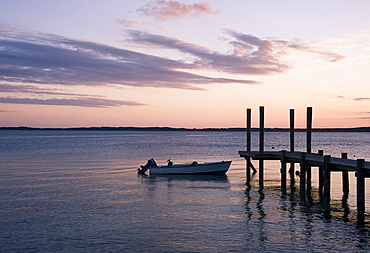 A dock at sunset in Dunmore Town, Harbour Island, Eleuthera, The Bahamas, West Indies, Atlantic, Central America