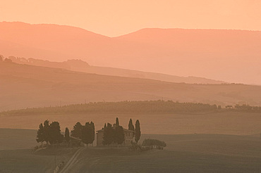 Dawn at Penella, a farmhouse surrounded by cypress trees and the misty hills of Val d'Orcia near Pienza, UNESCO World Heritage Site, Tuscany, Italy, Europe