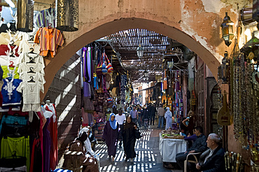 The view through an arch of shoppers in the souk in Marrakech, Morocco, North Africa, Africa