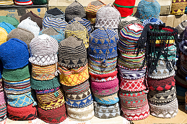 Brightly coloured knitted wool hats for sale in the souk in Marrakech, Morocco, North Africa, Africa