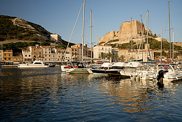 A view of yachts in the harbour and the citadel in Bonifacio, Corsica, France, Mediterranean, Europe