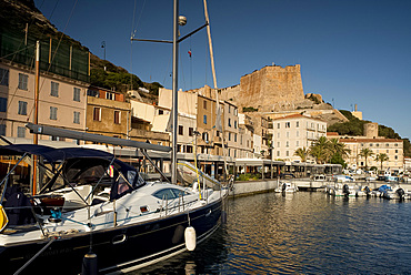 A view of yachts in the harbour and the citadel in Bonifacio, Corsica, France, Mediterranean, Europe