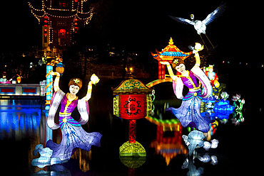 Chinese lanterns reflected on a lake during the Magic of Lanterns Festival at the Montreal Botanical Garden, Montreal, Quebec Province, Canada, North America