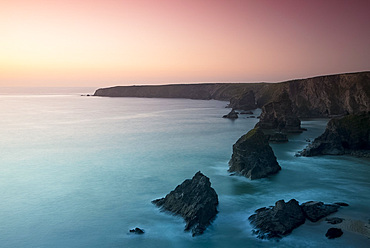 A view of the Bedruthan Steps at dusk, Cornwall, England, United Kingdom, Europe