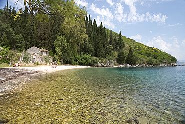 The pebble beach at Kouloura on the northeast coast of Corfu, Ionian Islands, Greek Islands, Greece, Europe