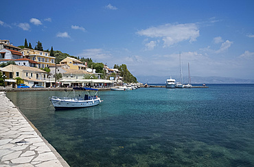 Boats in the harbour in Kassiopi on the northeast coast of Corfu, The Ionian Islands, Greek Islands, Greece, Europe