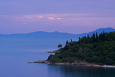 Sunset on the northeast coast of Corfu near Agios Stefanos, Corfu, Ionian Islands, Greek Islands, Greece, Europe