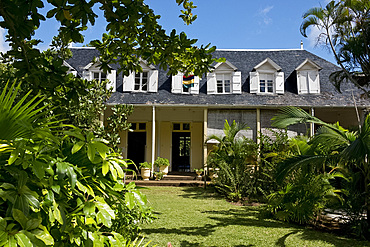 Tropical plants surrounding Eureka House, a preserved colonial style house built in 1830, Moka, Mauritius, The Indian Ocean, Africa