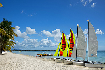 Colourful sailboats on the beach at Trou aux Biches on the north west coast of Mauritius, Indian Ocean, Africa