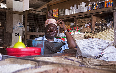 A man wearing a traditional kofia in the market in Pangani, Tanzania, East Africa, Africa