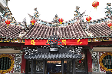 Lanterns outside the Ong Bon Pagoda and a Tet New Year's banner in Ho Chi Minh City, Vietnam, Indochina, Southest Asia, Asia