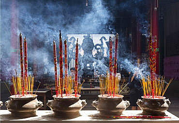 Incense burning in urns and worshippers in the Chua On Lang Pagoda in Ho Chi Minh City, Vietnam, Indochina, Southeast Asia, Asia