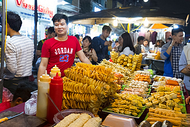 Chips and skewers on sale at a night market in the Old Quarter of Hanoi, Vietnam, Indochina, Southeast Asia, Asia