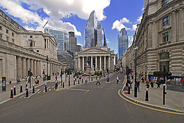 Skyscrapers of the City of London rising behind the Bank of England and the Royalo Exchange
