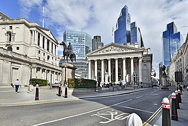 Skyscrapers of the City of London rising behind the Bank of England and the Royalo Exchange