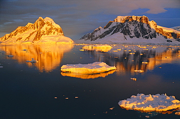 Coastal landscape lit by the midnight sun, Antarctic Peninsula, Antarctica