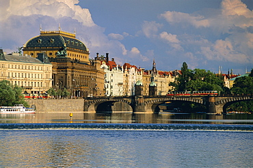 The National Theatre and houses along the Vltava River, Prague, Czech Republic, Europe