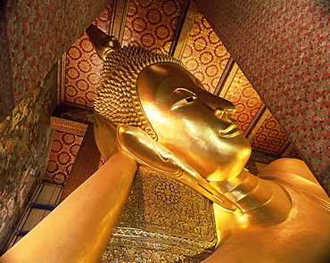 Detail of the head of the 46m long statue of the Reclining Buddha, Wat Pho (Wat Po) (Wat Chetuphon), Bangkok, Thailand, Southeast Asia, Asia